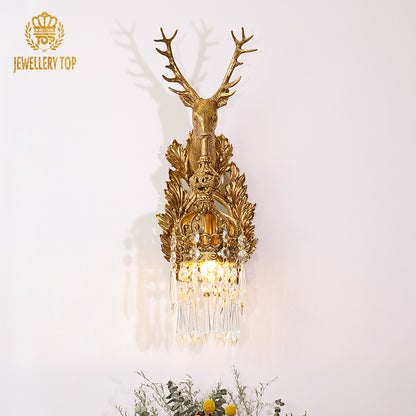 The home decorative wall light mounted beside green plants, adding a touch of natural sophistication.