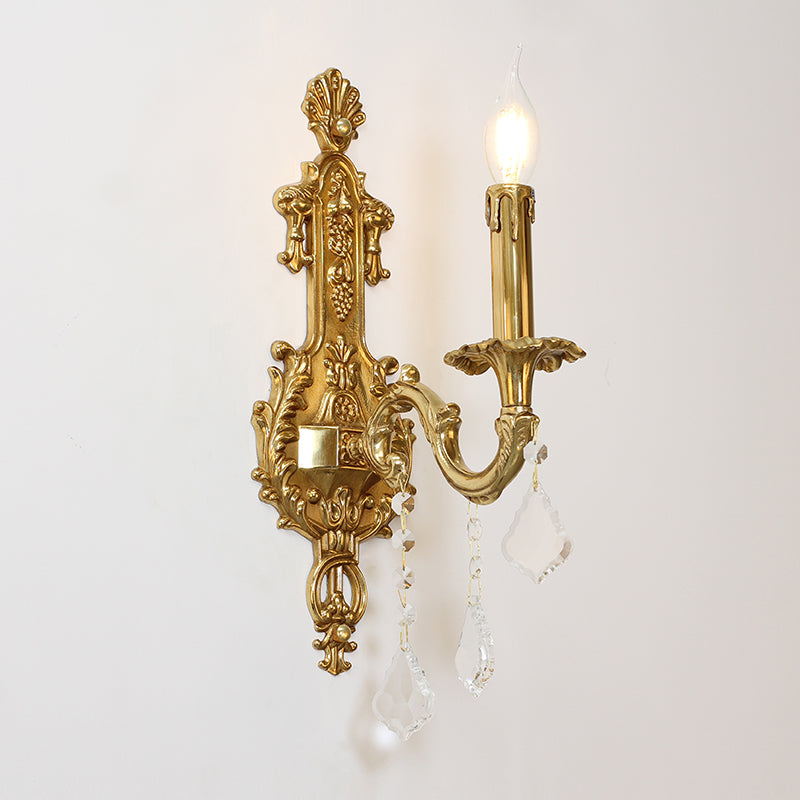 Detailed macro shot of the central brass column featuring exquisite scrollwork and relief.