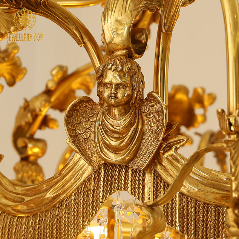 Detailed macro shot of a brass angel figurine and crystal strings on a decorative chandelier.