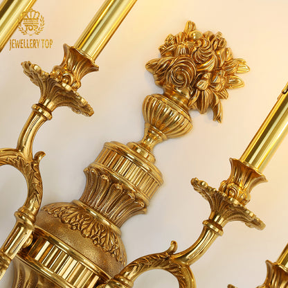 Extreme macro detail of the wall lamp's central floral relief carving, showcasing intricate petal and leaf textures.