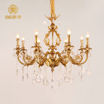 Extreme detail shot of the ornate solid brass acanthus leaf arm and crystal connection.
