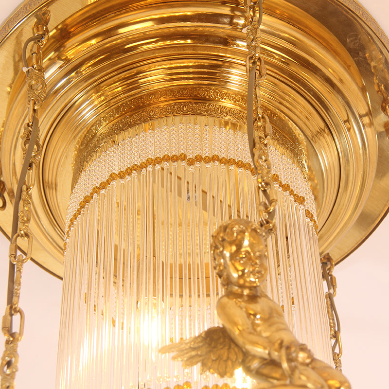 Close-up macro of a cherub sculpture, brass chain, and cascading crystal bead strings.