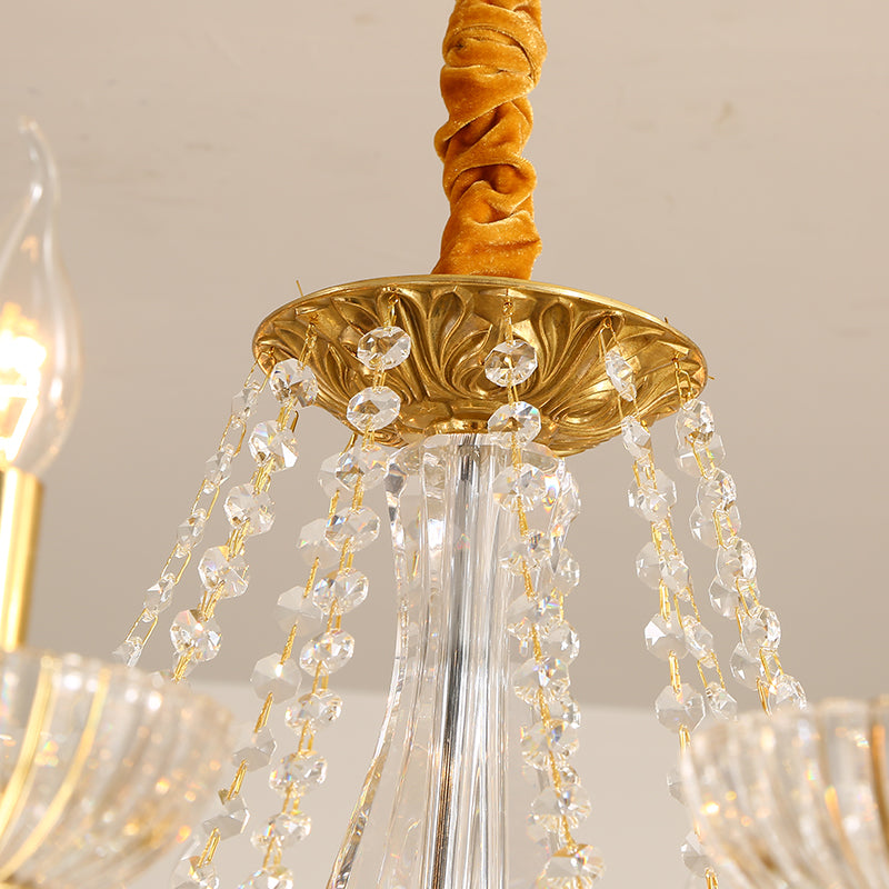 Extreme close-up of a velvet rope, ornate brass boss, and strings of faceted crystal beads.