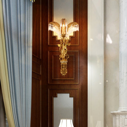 The French classical wall sconce installed on a rich brown wood-paneled wall between blue curtains and a white column.