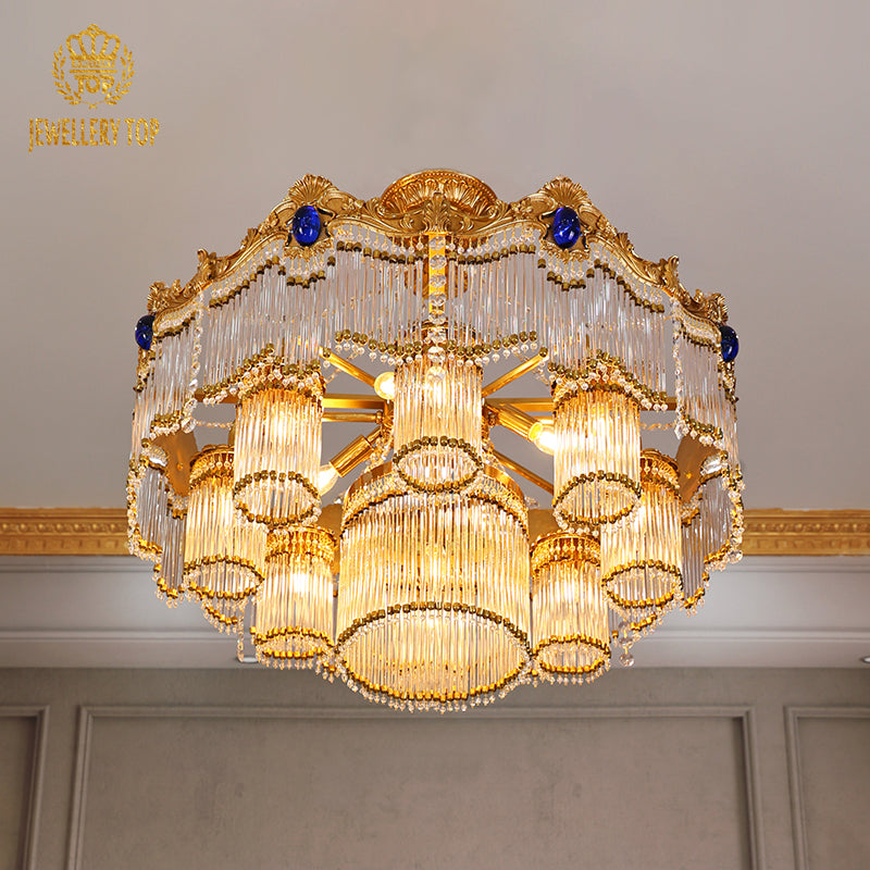 JEWELLERY TOP brand's european luxury chandelier highlighting the cobalt blue oval gemstones and intricate brass scrollwork details.