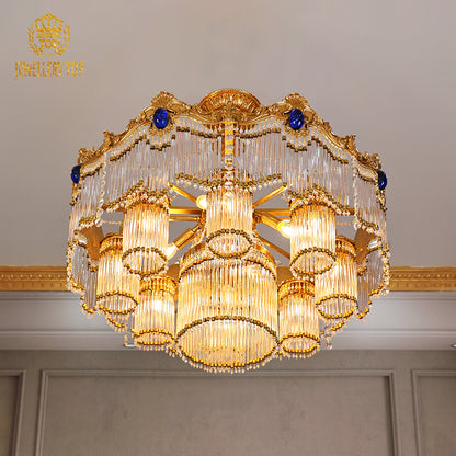 JEWELLERY TOP brand's european luxury chandelier highlighting the cobalt blue oval gemstones and intricate brass scrollwork details.