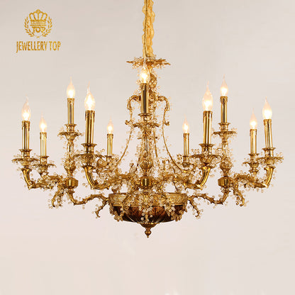 JEWELLERY TOP brand's ornate brass chandelier with symmetrical arms and crystal decorations.