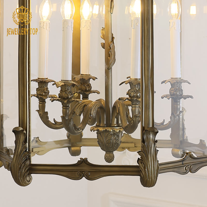 JEWELLERY TOP brass pendant light with white shade, candle bulb, and clear glass casing.