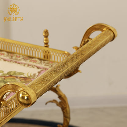 Close-up detail of the hand-engraved solid brass push handle on The Dionysus serving cart by Jewellery Top.