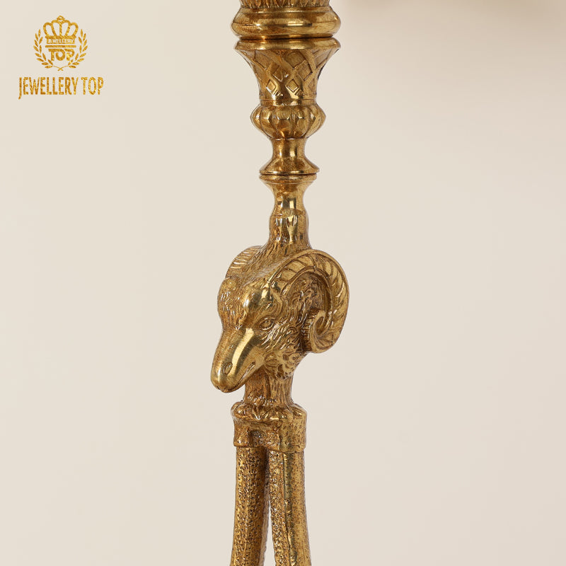 Macro close-up of the intricately carved solid brass ram head sculpture by Jewellery Top.