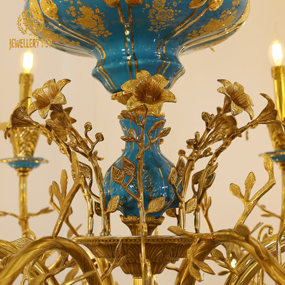 Extreme detail shot focusing on the symmetrical arrangement of the candleholders and the elaborate cast brass vinework.