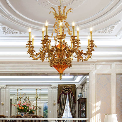 The brass chandelier installed in an elegant room with a decorative white ceiling and wainscoting.