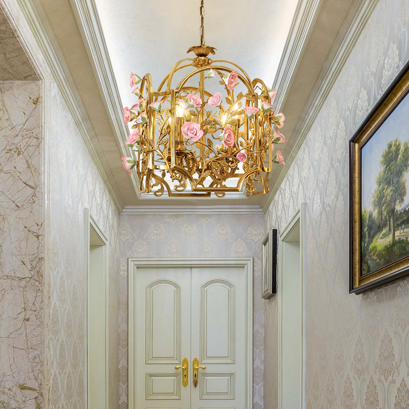 A decorative lantern chandelier installed in an elegant residential hallway with patterned wallpaper.