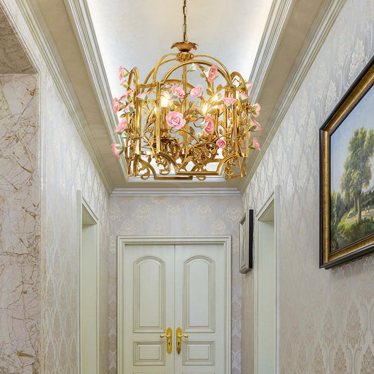 A decorative lantern chandelier installed in an elegant residential hallway with patterned wallpaper.