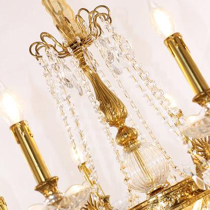 Extreme close-up of a fluted brass arm, a crystal rod, and cascading crystal bead chains.