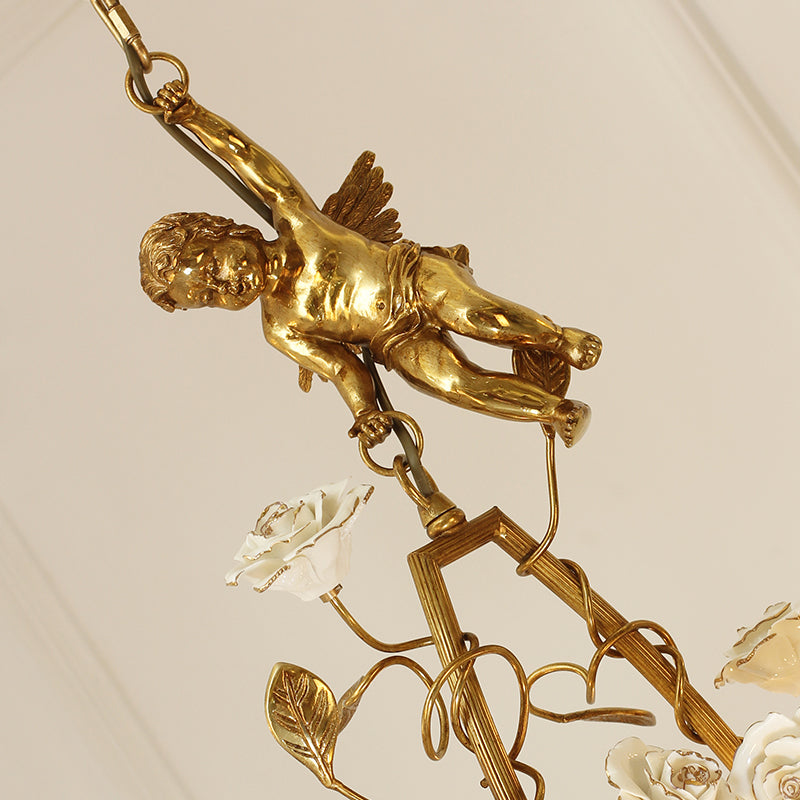 Extreme detail shot focusing on the textured golden leaf accents and the glowing candle-style filament bulbs.