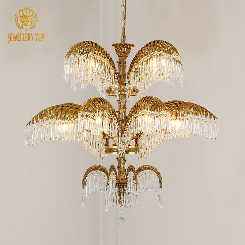 Wide angle view of the luxury chandelier illuminating an ornate ceiling with classical frescoes and gold trim.