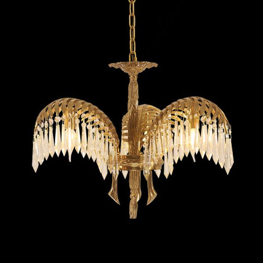 Serres Chaudes Impériales brass and crystal chandelier with palm motif on black background.