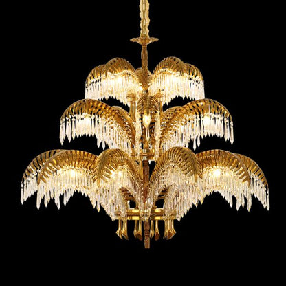 The brass chandelier casting a warm, dappled light pattern on a classic interior wall.
