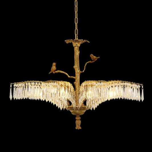 Opéra Garnier classical brass chandelier with birds and crystal on black background.