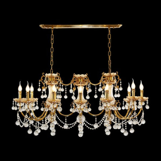 Full view of the French Baroque Grande Crystal Cascade brass chandelier glowing against a stark black background.