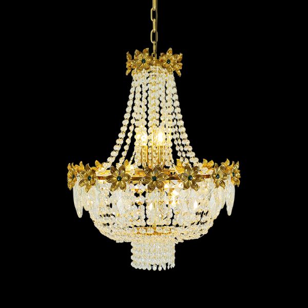 Full view of the French Floral Gem & Cascading Crystal brass chandelier glowing against a stark black background.