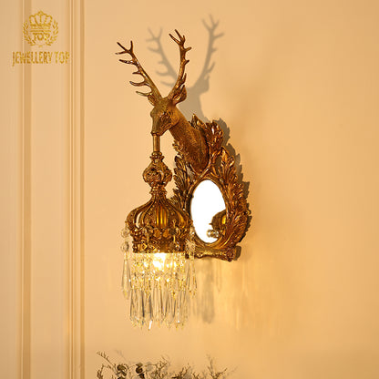 Branded product shot of the golden deer head wall lamp with mirror, isolated on a clean background.