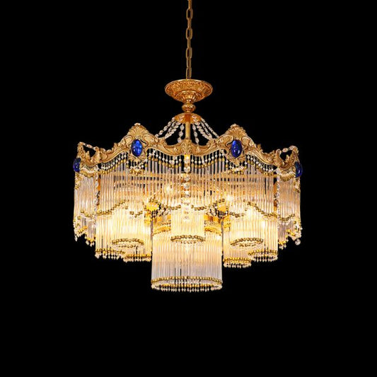 Full studio shot of the French Versailles style sapphire and K9 crystal brass chandelier glowing against a stark black background.