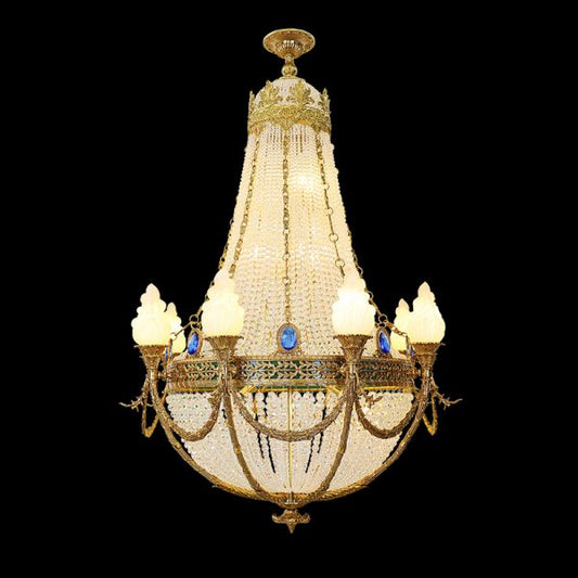 Full studio shot of the French Imperial Regalia gilded brass and sapphire crystal chandelier glowing against a stark black background.