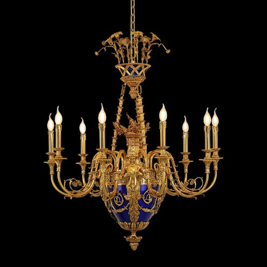The baroque brass chandelier with candle bulbs and blue centerpiece, isolated on black.