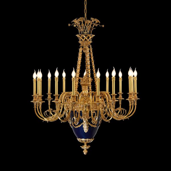 Golden brass castle chandelier with a dark blue decorative element, black background.