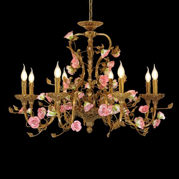 A french ceramic flowers chandelier illuminating a lavishly decorated classic residence with ornate wall moldings.