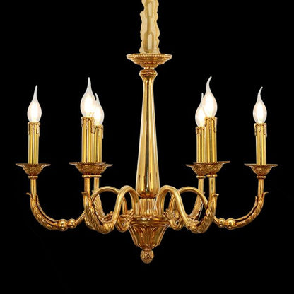 Golden antique brass chandelier with multiple candle bulbs on a black background.
