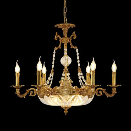 Phare d'Opulence brass chandelier with crystal beads and a glass bowl, on black background.