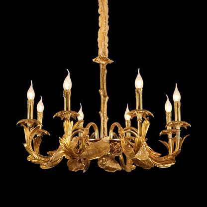 JEWELLERY TOP brand's decorative chandelier featuring detailed brass leaves and candle-style bulbs.