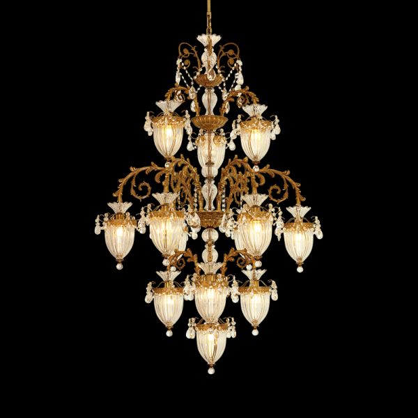 A grand french chandelier installed in a residence with a high ceiling, ornate plaster moldings, and draped curtains.