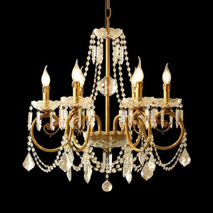 Boudoir de Perles six-arm brass crystal chandelier on a black background, front view.