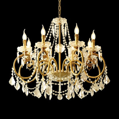 French brass chandelier with dense crystal bead curtains and candle bulbs, isolated on black.