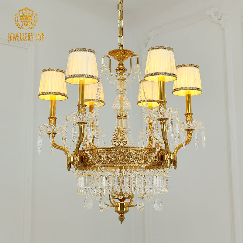 JEWELLERY TOP brand's french chandelier showcasing ornate golden arms and fringed fabric lampshades.