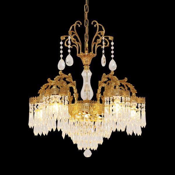 Opulent vintage brass chandelier with crystal cascades on a black background, European style.
