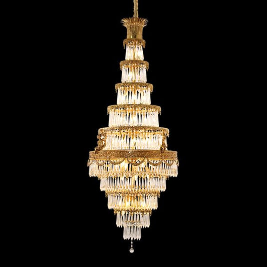 Multi-tiered Elysian Ascension brass chandelier with crystal strands on black background.