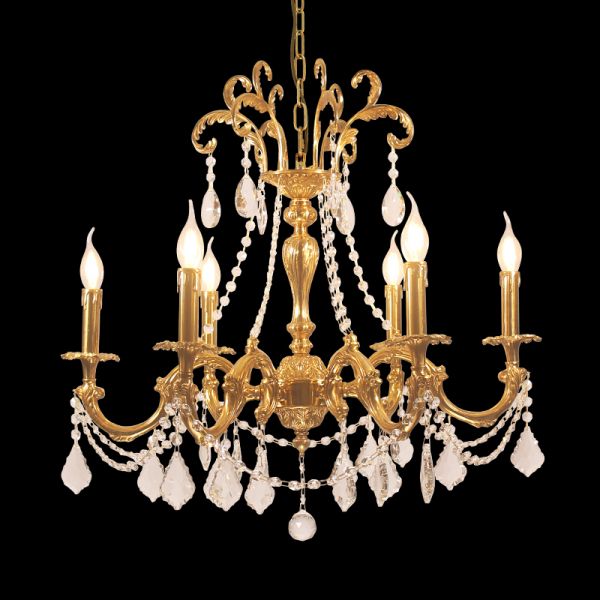 An eight-light French brass chandelier with crystal beads and ornate metalwork, isolated on black.