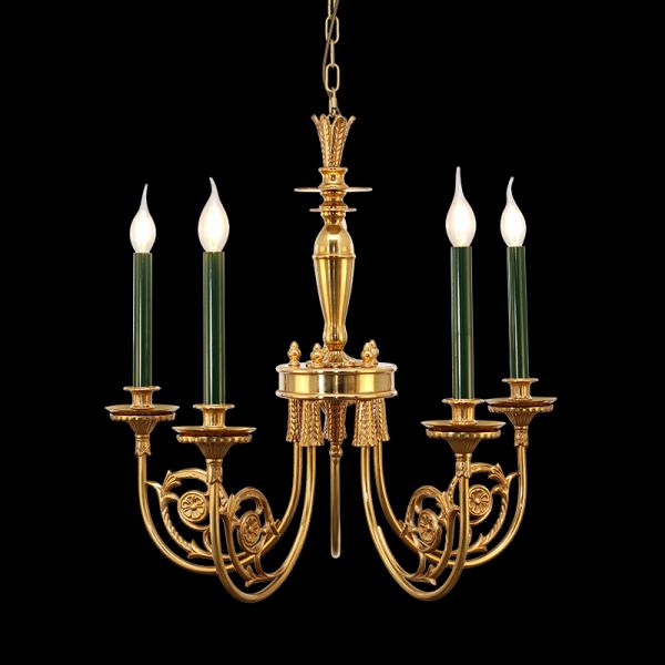 Classical brass chandelier with green candle bulbs and a conical center, on black background.