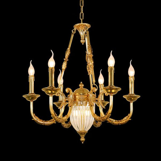 Full studio shot of the French Belle Époque gilded solid brass and crystal chandelier glowing against a stark black background.