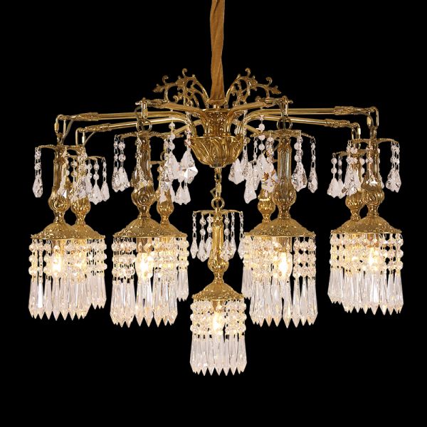 Full studio shot of the French Botanical Opulence gilded brass and crystal branch chandelier glowing against a stark black background.