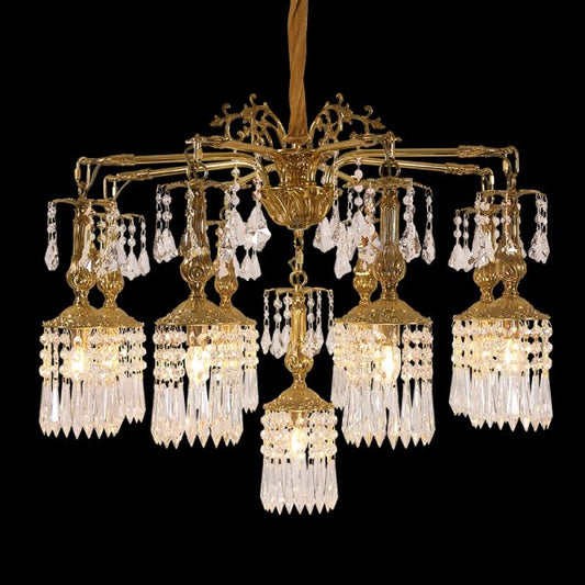 Full studio shot of the French Botanical Opulence gilded brass and crystal branch chandelier glowing against a stark black background.