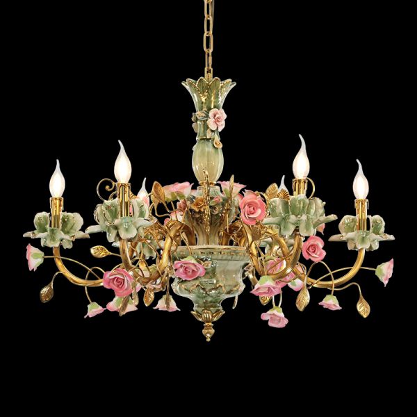 Fleur de Royaume French brass chandelier with pink ceramic flowers on black background.