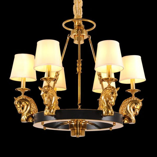 Full studio shot of the French Equestrian Grandeur solid brass and linen shade chandelier glowing against a stark black background.
