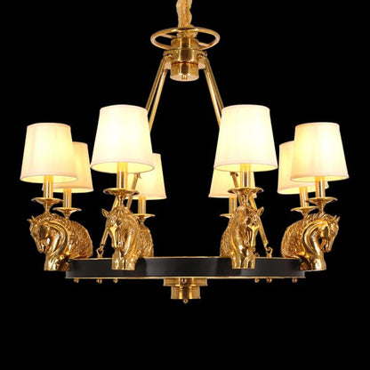 A french chandelier installed in a grand residence hallway with classic wall paneling and a polished marble floor.