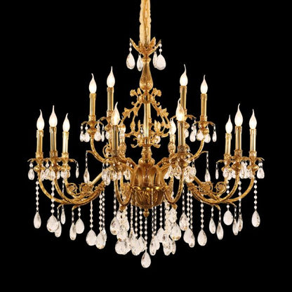 JEWELLERY TOP brand's living room brass chandelier with intricate brass arms and candle-style lights.